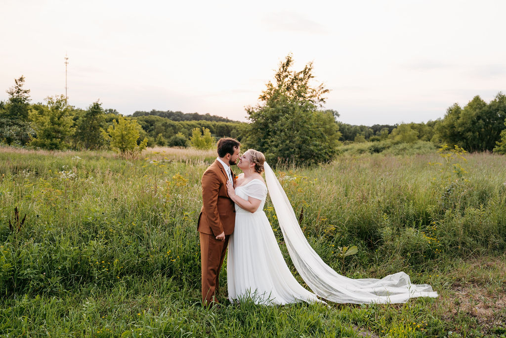 Bride and Groom in field