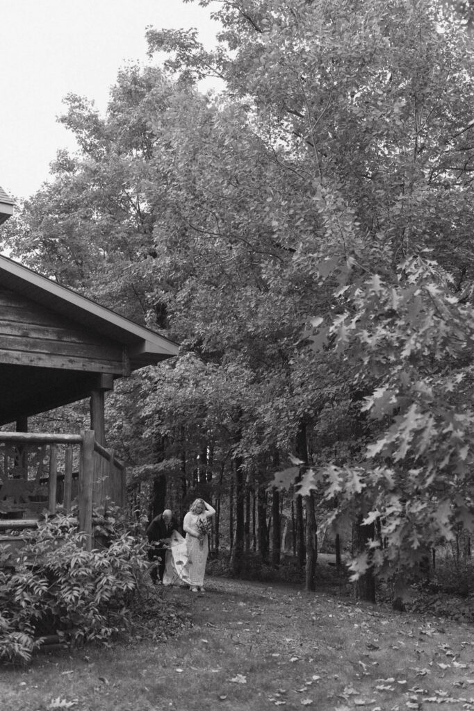 Black and white of bride with father