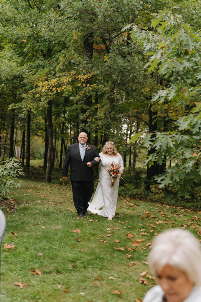 Father of bride walking her down the aisle