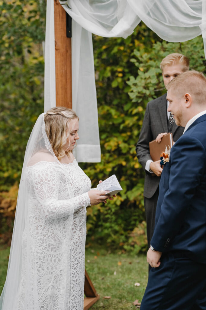 Bride reading vows to groom