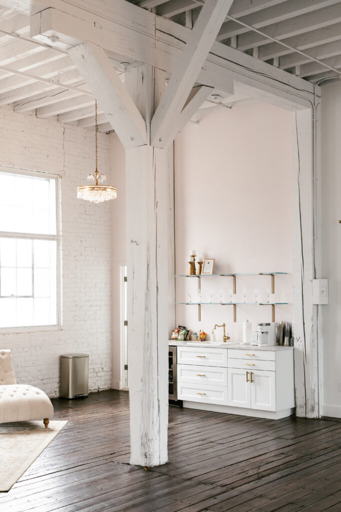Bridal suite with white walls, a light pink accent wall