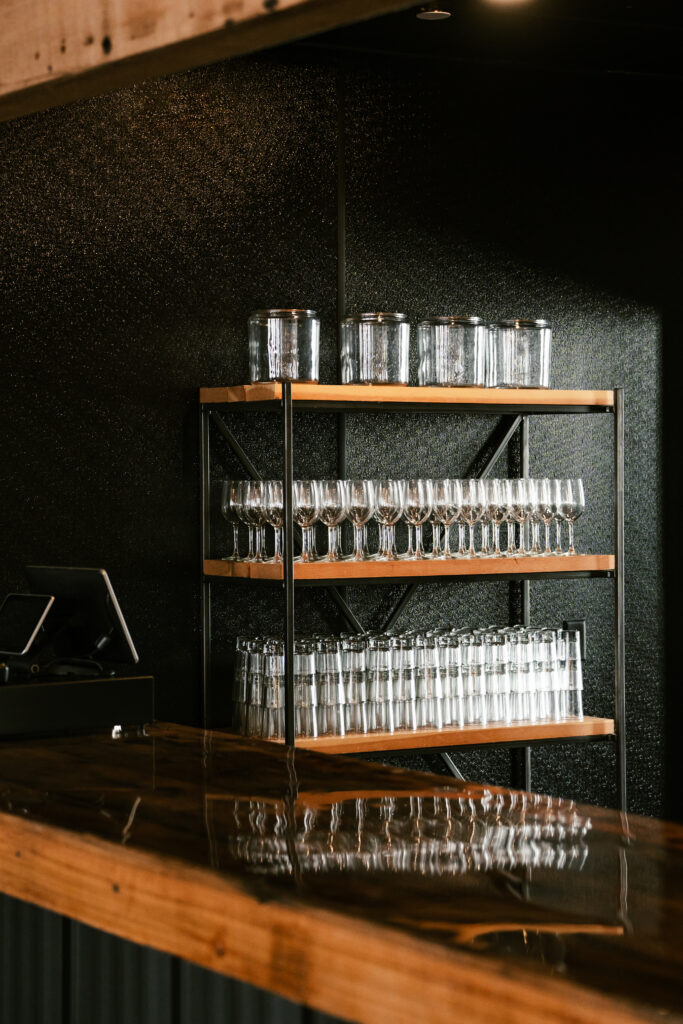 Glasses behind a bar in a Minnesota wedding venue